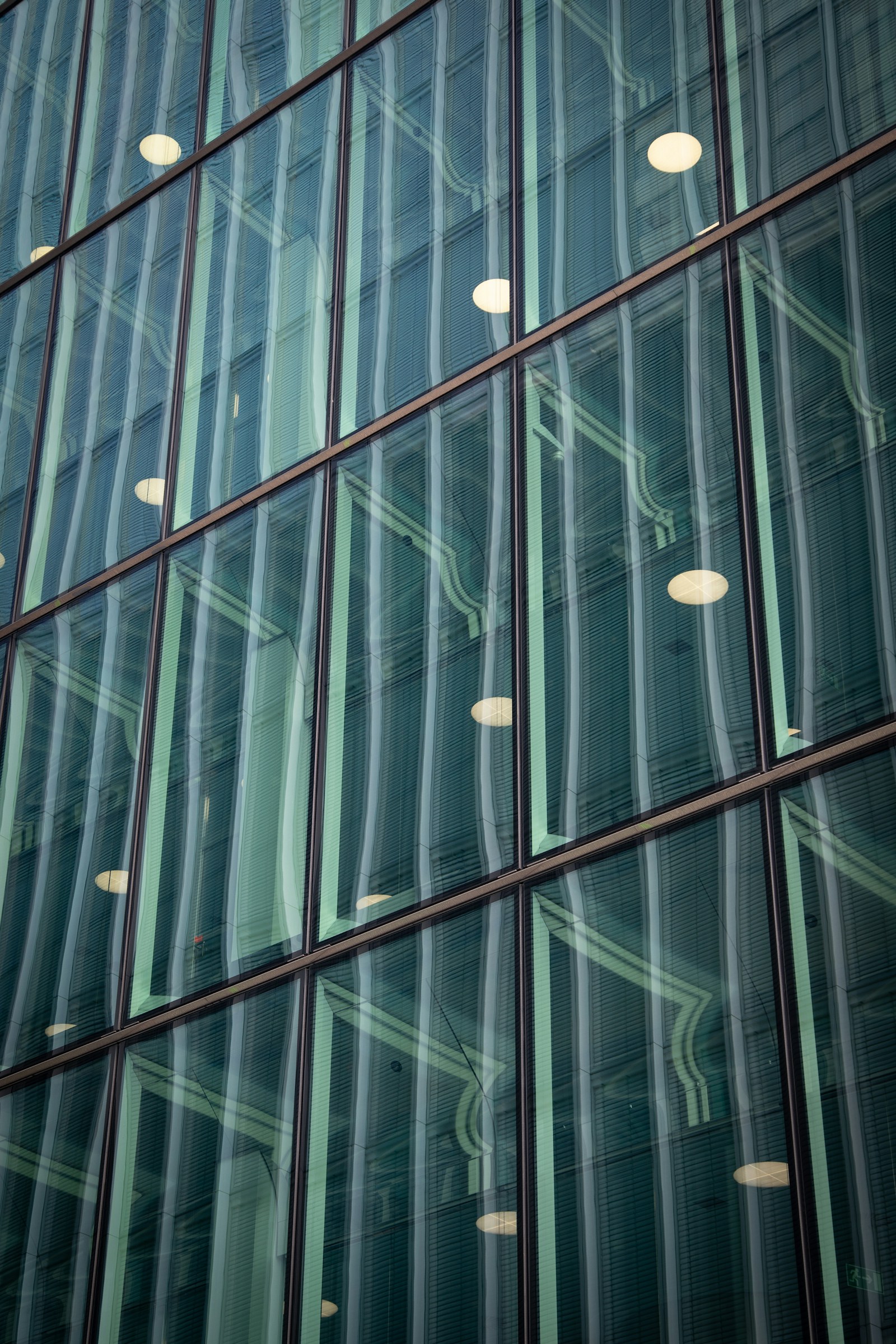 Detail of a modern glass facade with integrated building lighting